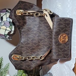 Michael Kors brown monogrammed handbag and wallet set.